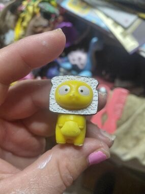 figurine is Loafy, a character from the collectible Hasbro Lost Kitties Series 1